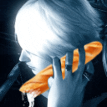 a woman is talking on an orange phone
