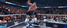 a man in a wrestling ring with the word smack on the wall
