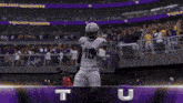 a football player wearing a white uniform with the number 18 on it