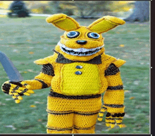 a person in a crocheted yellow bunny costume is holding a sword