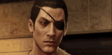 a close up of a man 's face with a eye patch on his eye .