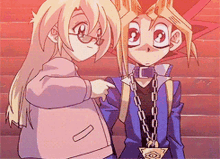 a boy and a girl are standing next to each other and the girl is pointing