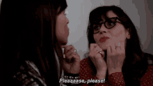 two women are talking to each other and one of them is making a face .