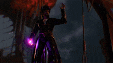 a hand is holding a purple object with a star in the middle