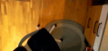 a blurred image of a room with a few cabinets and a fire coming out of the ceiling .