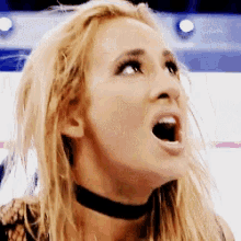 a close up of a woman with her mouth open looking up