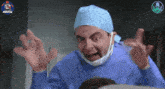 a man in a surgeon 's outfit is making an angry face