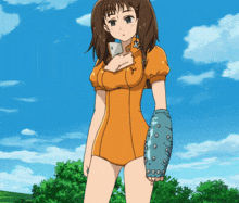 a girl in an orange dress is holding a blue arm