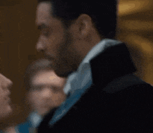 a man and a woman are dancing together in a room .