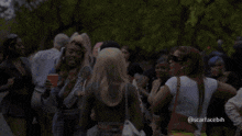 a group of women standing in a crowd with the caption scarfacebh