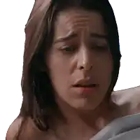 a close up of a woman 's face with a sad look on her face