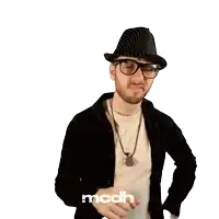 a man wearing a hat and glasses is pointing at the camera with a mcdh logo in the corner