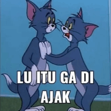 tom and jerry are standing next to each other and hugging .