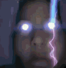 a close up of a person 's face with lightning bolts coming out of it