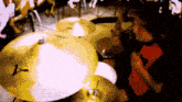 a person is playing a drum set with a cymbal that says y on it