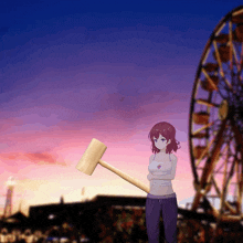 a girl is holding a wooden hammer in front of an ferris wheel
