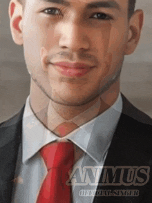 a man in a suit and tie with the word anmus official singer on the bottom