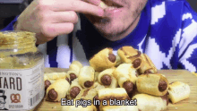 Eat Pigs In A Blanket With Mustard And Ranch Sauce GIF