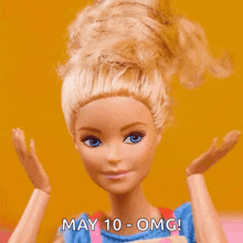 a barbie doll says may 10 - omg on the bottom