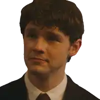 a man in a suit and tie is smiling