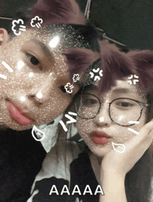 a boy and a girl with cat ears on their faces with a caption that says aaaaa