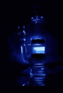 a close up of a glass pipe with a blue background