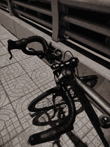 a black and white photo of a bicycle with a handlebar that says ' shimano ' on it