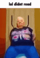 a man with a bald head is sitting on a trampoline with the words lol didnt read .