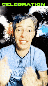 a man in a blue shirt with the word celebration on the top
