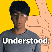 a man wearing glasses is giving a thumbs up with the words understood behind him