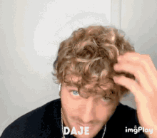 a close up of a man 's face with the words daje on the bottom right
