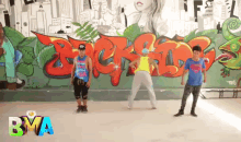 a group of people are dancing in front of a wall with graffiti on it and the word bva on the bottom