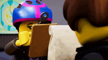 a lego character holding a clipboard with a roll of toilet paper on it