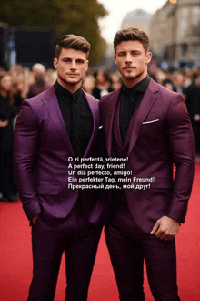 two men in purple suits are standing next to each other on the red carpet