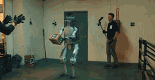 robot robotic kicking a robot punching a robot aggressive