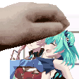 a close up of a person holding a cartoon character 's head .