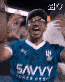 a man wearing a blue jersey that says savvy