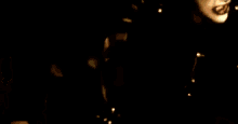 a blurry picture of a person 's face in the dark .