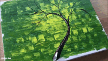 a painting of a tree on a green background with wow art below it
