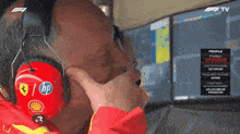 a man wearing red headphones with a hp logo on them