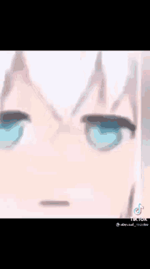 a close up of a anime girl 's face with blue eyes .