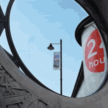 a sign that says 2 hou is hanging on a pole