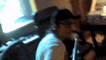 a blurry picture of a person playing a piano