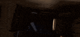 a person laying on a bed with a light shining on them