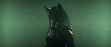 a silhouette of a person in a dark room with a large mouth