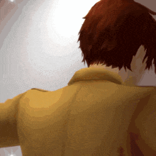 a close up of a person 's back with a yellow shirt on