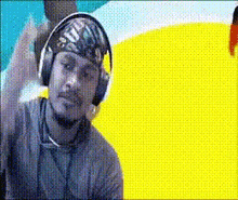 a man wearing headphones and a bandana that says ' i 'm a ' on it