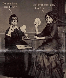 a black and white photo of two women playing cards with the caption do you have any f * cks not even one girl go fish