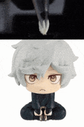 a close up of a figurine of a person with white hair