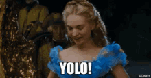 a woman in a blue dress with the words yolo on her chest